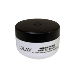 Olay Age Defying cream applying on cheek for refreshed look.