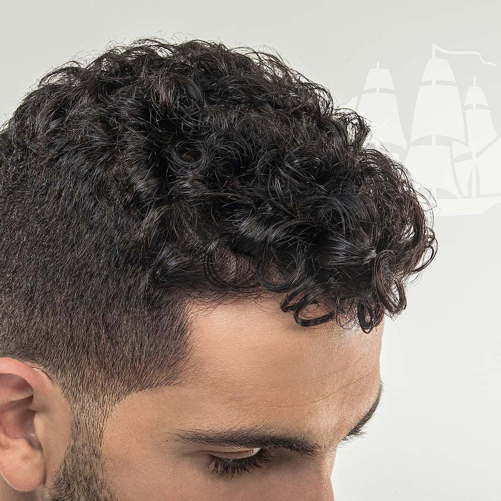 Old Spice Wavy Curly Leave-In Bottle helps reduce frizz and define curls.