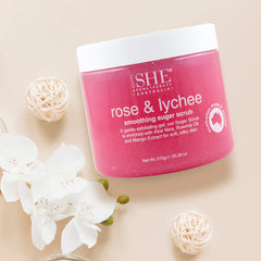 Australian-made Om She Rose and Lychee scrub bottle on display for skin nourishment