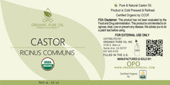 OPO Organic Castor Oil on scalp for nourishing hair treatment.