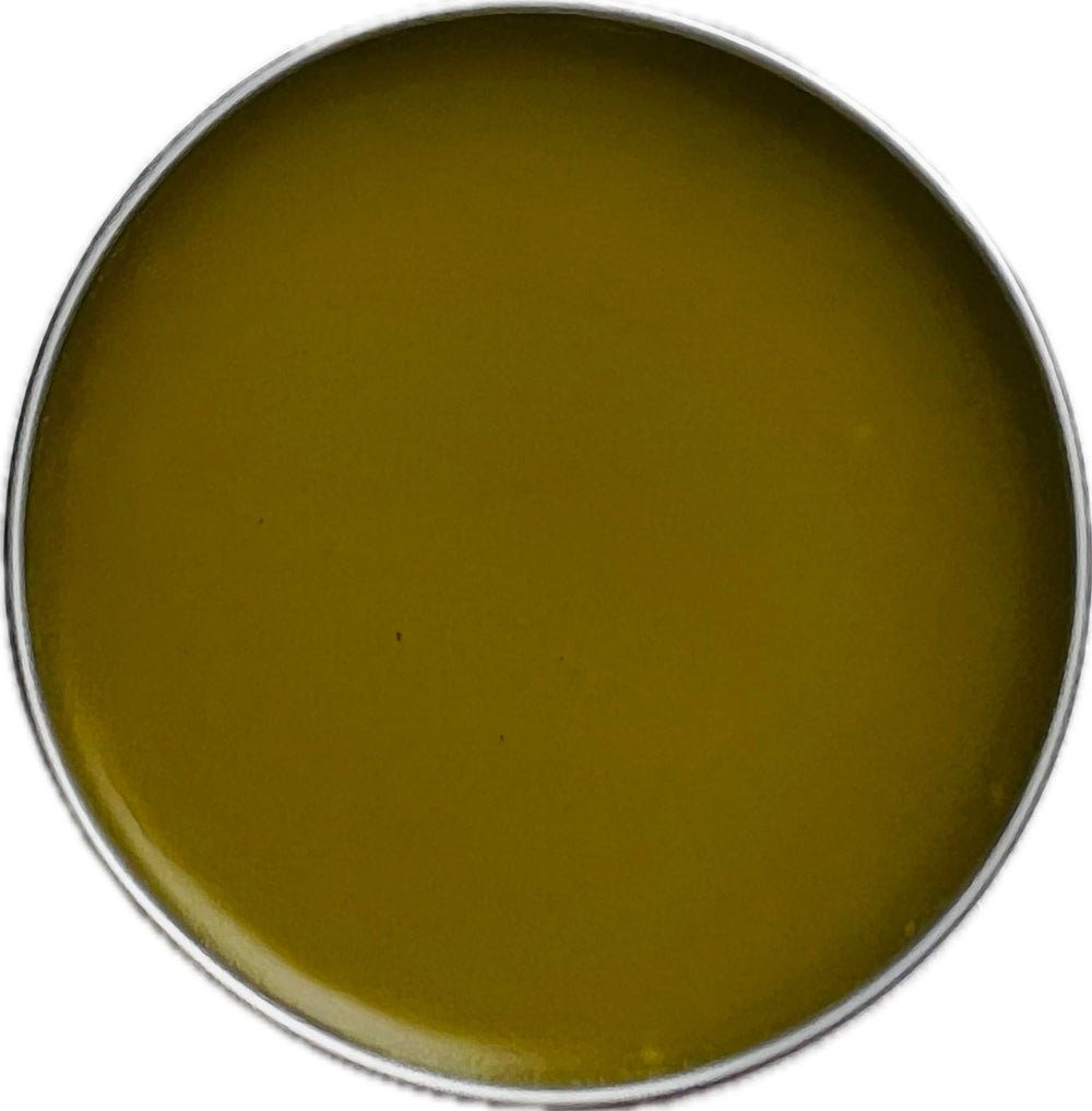Organic Herbal Salve oregano-infused oil close-up highlights citrus aroma and skin nourishment.