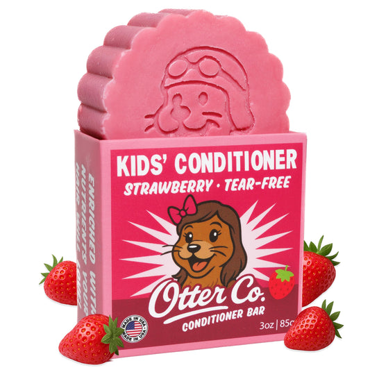 Otter Co Kids strawberry conditioner bar packaging highlights tear-free care for toddlers.