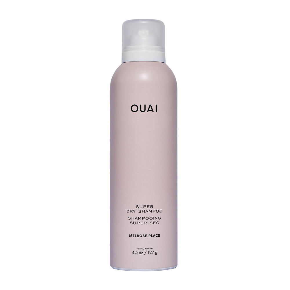OUAI Super Dry Shampoo bottle pour showing oil absorption for between-wash refresh.