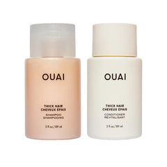 OUAI Thick Shampoo bottle pouring for easy application and hydration.