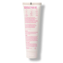 oVertone Magenta Majesty hands applying conditioner for color maintenance
