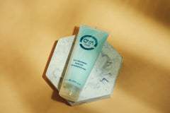 OYA Treatment travel-size packaging for convenient on-the-go conditioning.