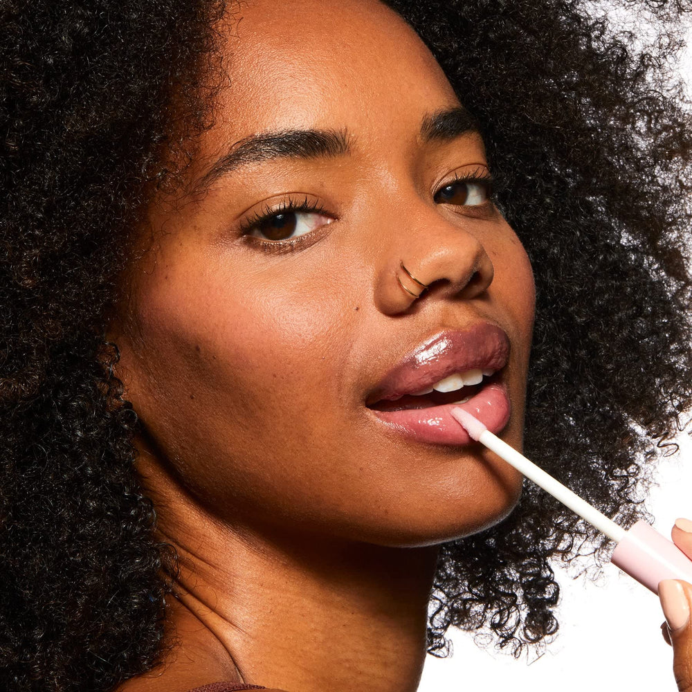 Pacifica lip plumping gloss on lips for natural-looking fullness