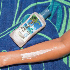 Panama Jack SPF 50 in water, illustrating its water resistance during swimming.