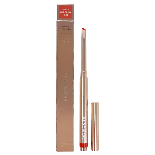 Patrick Ta Major Headlines lip crayon in She's Not From Here swatch for bold orange-red lips.