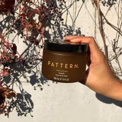 PATTERN Breakage Barrier Mask on curls delivers softness and hydration.
