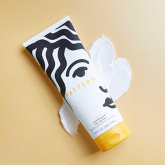 PATTERN Heavy Conditioner in shower-ready shot shows curl definition during rinse.