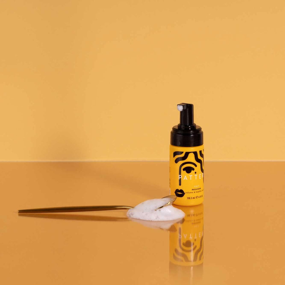 PATTERN Mini curl mousse foam shows airy texture for defined wash-and-go.
