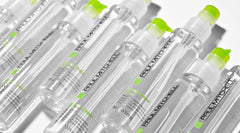 Paul Mitchell Super Skinny Serum applied to damp hair accelerates drying and smooths strands.