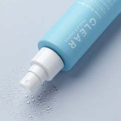 Spray-on bottle demonstrates quick, even coverage on the back.