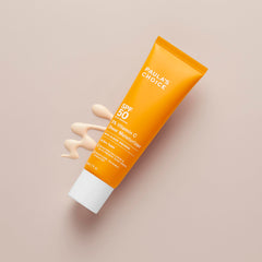 Paula's Choice sunscreen texture on skin during application highlights smooth glide.