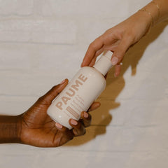 PAUME Probiotic Hand Balm in use massaged into palm