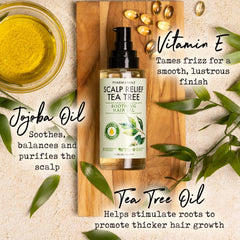 PHARM TO TABLE Tea Tree Hair Oil dropper releasing oil for itchy scalp relief.
