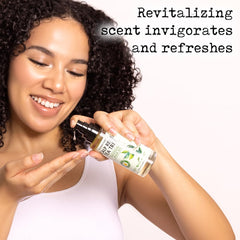PHARM TO TABLE Tea Tree Hair Oil on hair strands delivering shine and bounce.