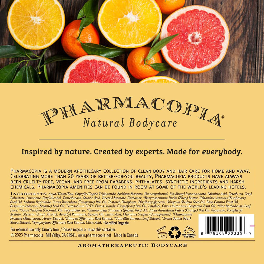 Pharmacopia Citrus Shampoo on shelf with citrus fruits conveying vibrant aroma