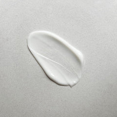 Pharmacopia Hotel Verbena lotion texture close-up with creamy, nourishing feel.
