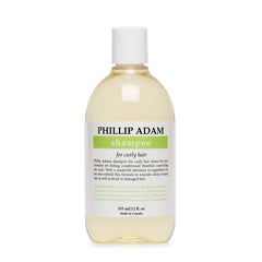 Phillip Adam Curly Shampoo bottle pouring hydration for curls