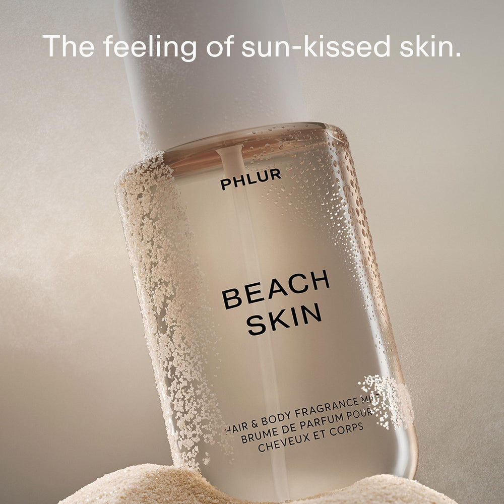 PHLUR Beach Skin mist spray action demonstrates easy all-over application.