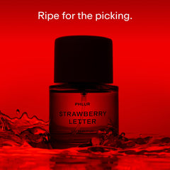 PHLUR Strawberry Letter bottle cap closeup highlighting premium packaging