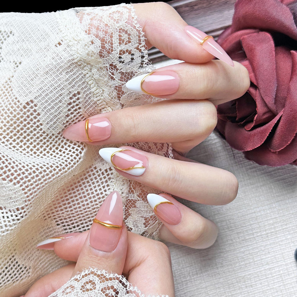 PHYLIN LEAF French pink nails with gold border for a fast, elegant manicure.