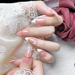 PHYLIN LEAF French pink nails with gold border for a fast, elegant manicure.