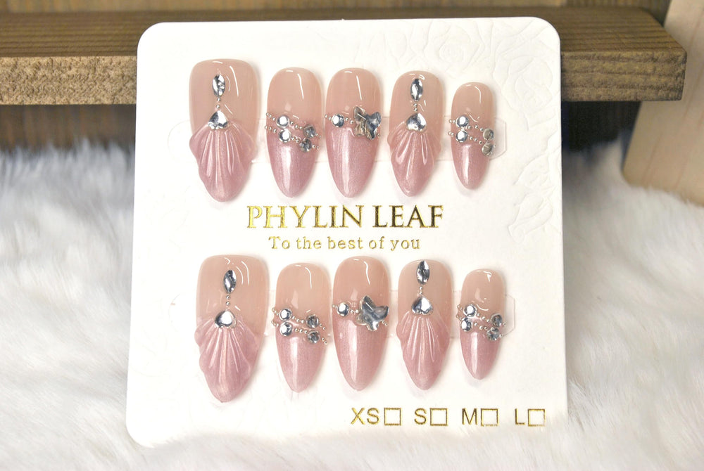 PHYLIN LEAF handmade press-on nails with pink sea-shell diamonds for a luxe look.