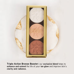 Physicians Formula Bronze Booster palette on cheek for buildable glow.