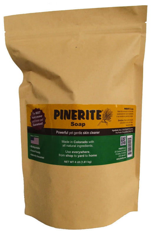 Pinerite powdered hand soap bottle close-up shows pine-based cleaning for greasy hands.