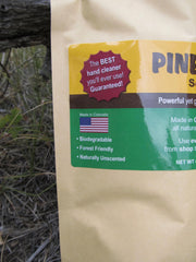 Pinerite powder dissolving in water shows easy grime removal.