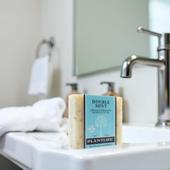Plantlife Double Mint bar soap lather closeup highlighting minty, moisturizing feel.