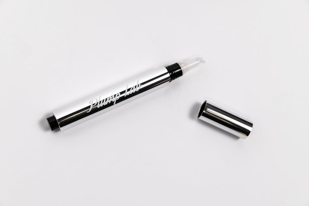 Plump Lab lip plumper gloss hydration glow on lips.