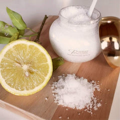 Premier Dead Sea Aromatic Salt Scrub texture closeup reveals mineral grains for gentle exfoliation.