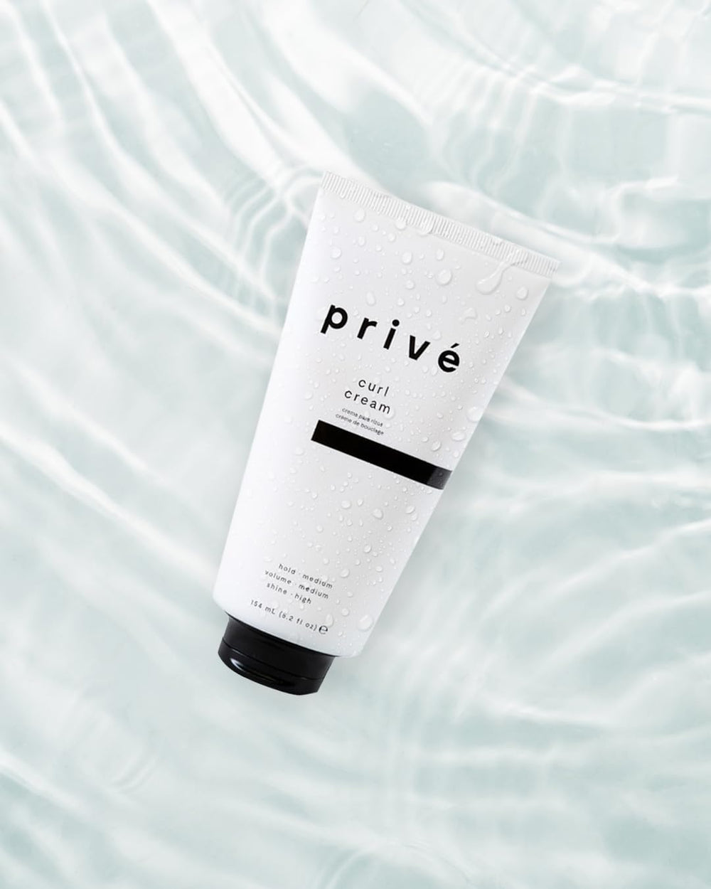 Prive curl cream being applied to hair for definition