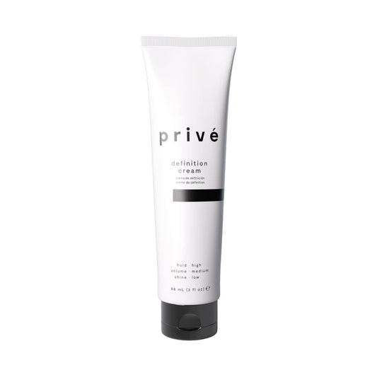 Privé Definition Hair Cream smoothing application for a sleek finish.