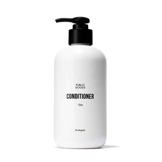 Public Goods conditioner bottle on sink highlighting natural ingredients for daily hydration.