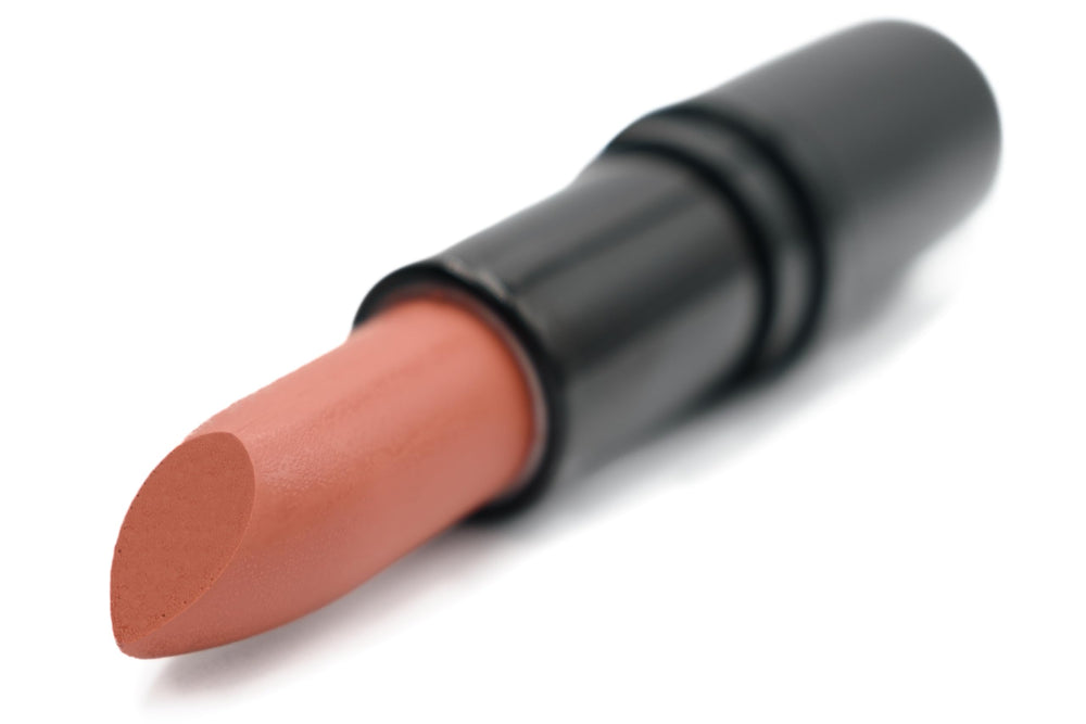 Pure Ziva Coral Orange Toffee application on lips for bold look.
