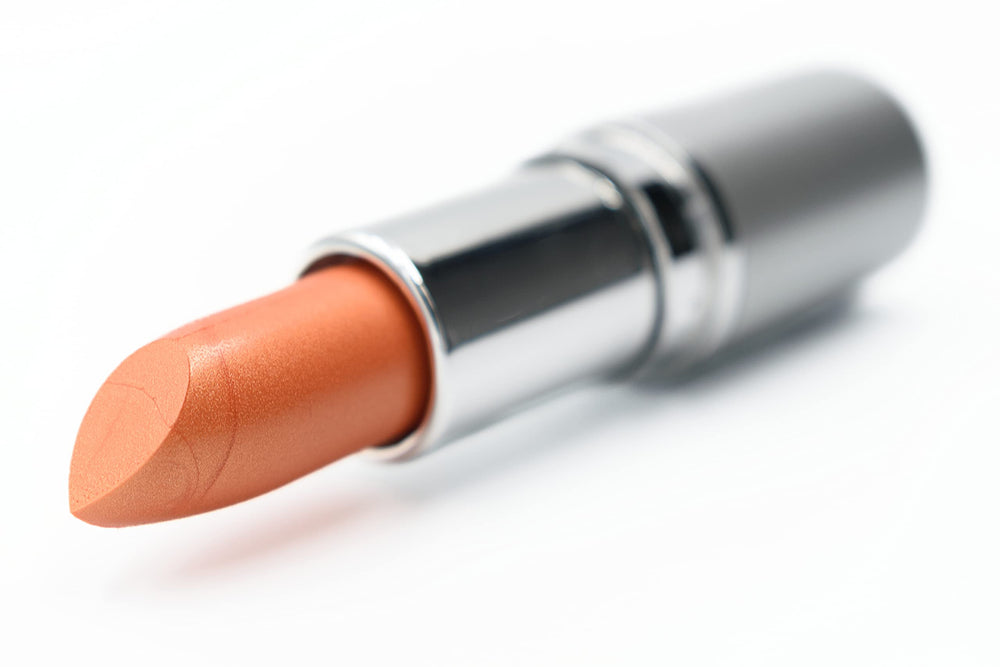 Pure Ziva Orange Flare Creme Lip Cream on hand shows shade quickly