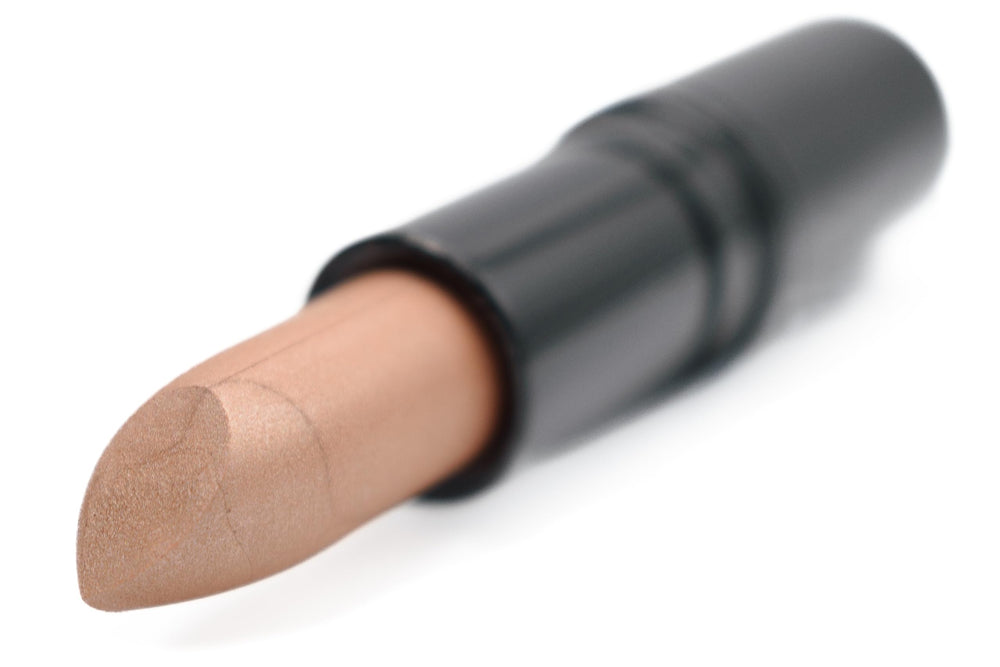 Pure Ziva Pebblestone Nude lipstick on lip demonstrates wearable bronze-nude finish for day-to-night looks.