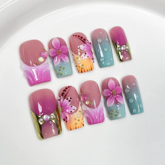 Qicaijia 10-piece press-on nails with 3D flowers for chic at-home glamour.