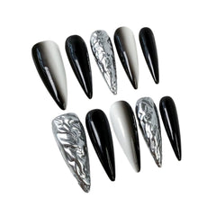 Qicaijia black white ombre stiletto nails for bold evening style.