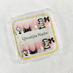 Qicaijia duck press on nails with black French tip for a bold look.