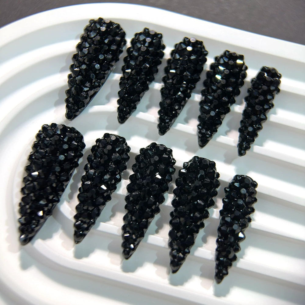 Qicaijia glossy almond nails showcase a 3D design for luxe appeal.