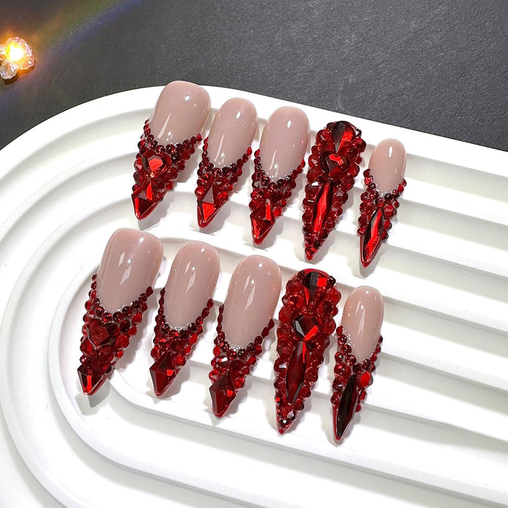 Qicaijia long almond nails with 3D designs ideal for party nights