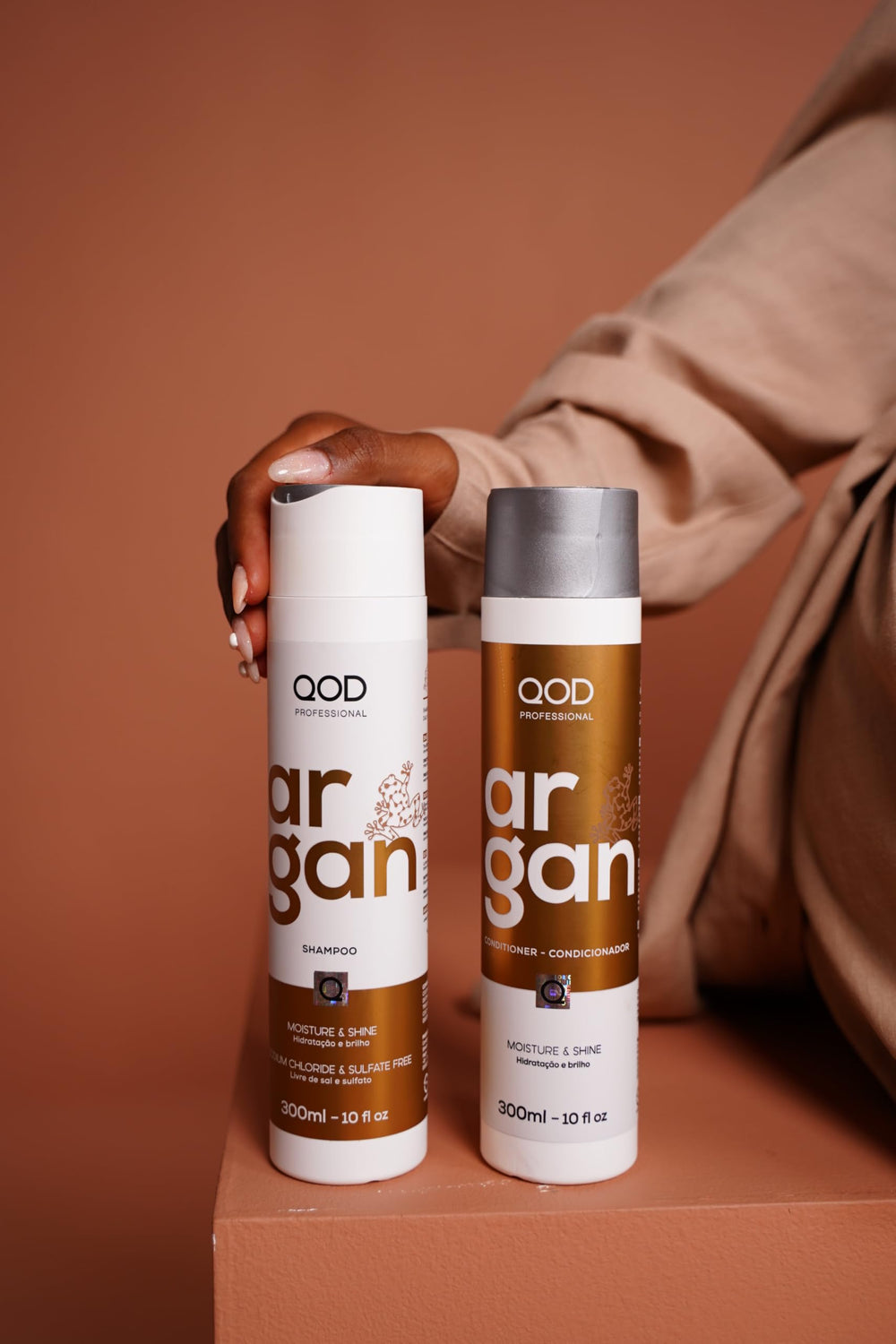 QoD Pro Argan conditioner bottle close-up emphasizing softness and detangling.