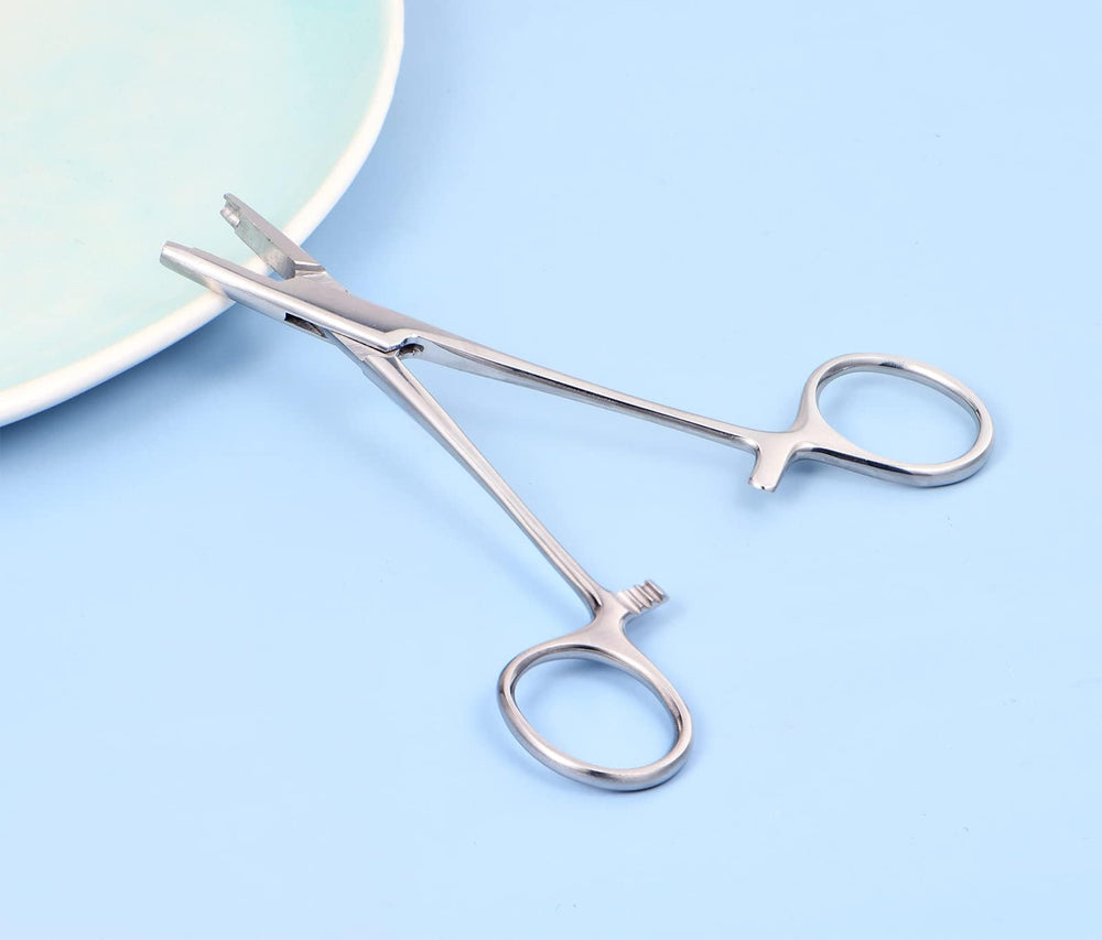 QWALIT jewelry changing tool with pliers to assist ball-cap adjustments.