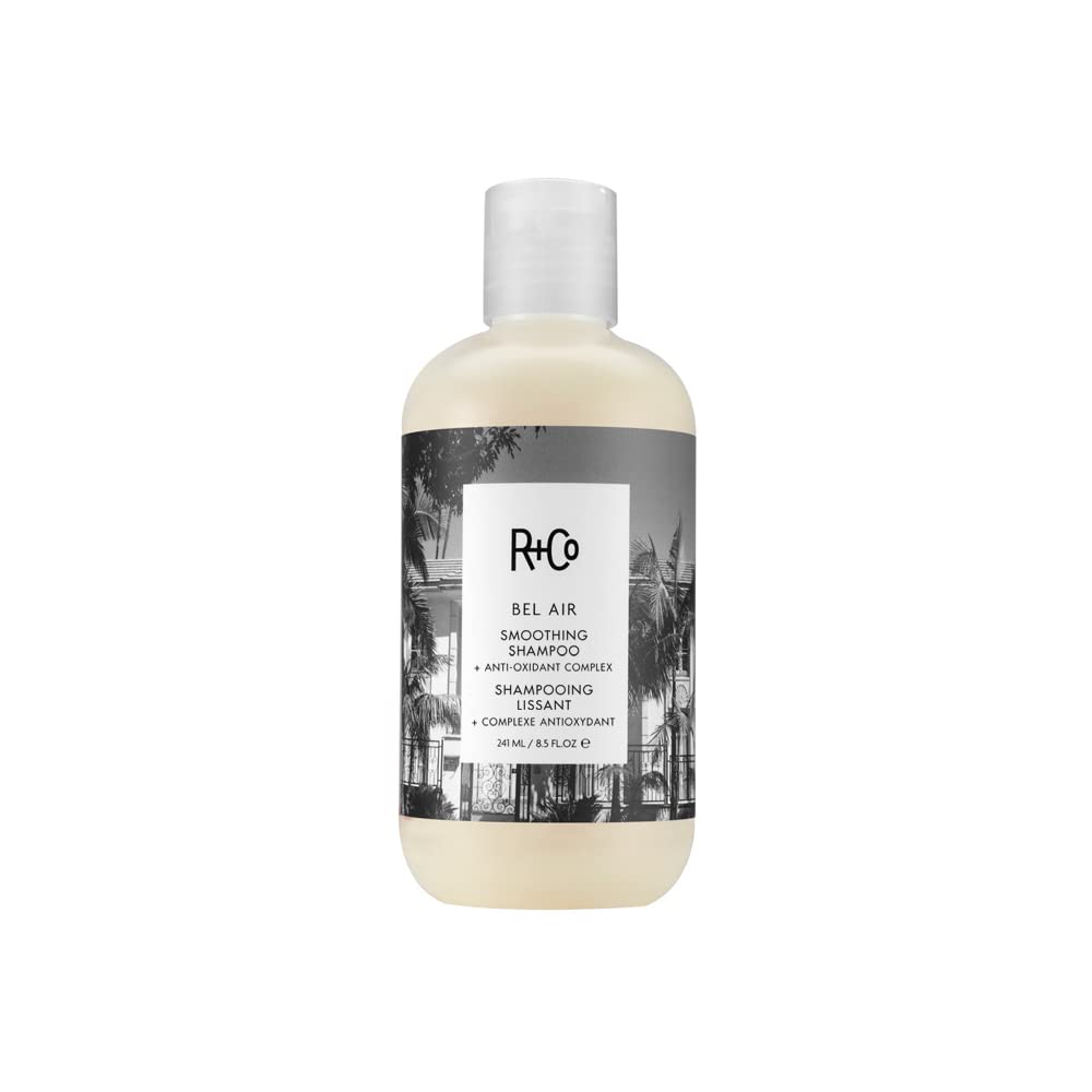 R+Co Bel Air smoothing shampoo bottle close-up for silky, frizz-free hair.